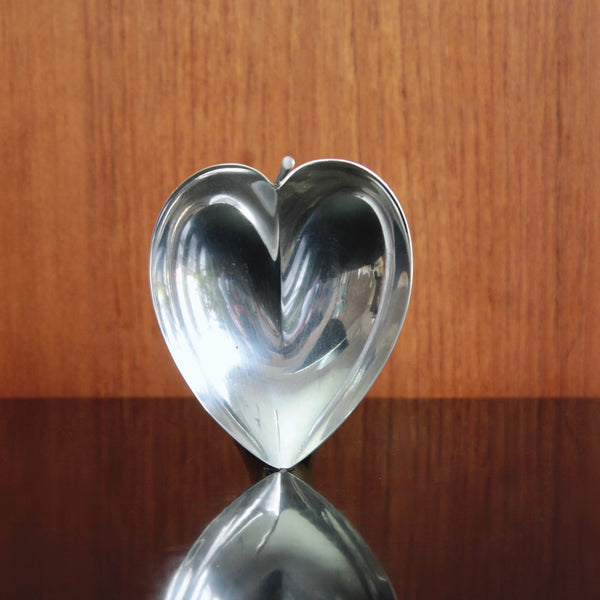 Head on shot of a Finnish Modernist sterling silver bowl designed by Tapio Wirkkala, organic heart-shaped form.