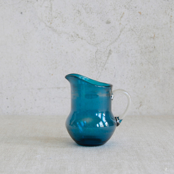 Vintage Riihimäki glass creamer designed by Helena Tynell, an elegant example of Scandinavian tableware design