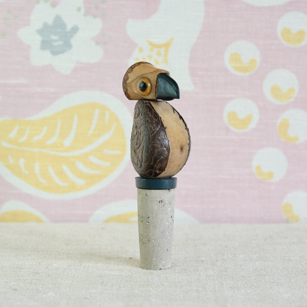 YZ Nut Bird bottle stopper combining tagua nut, rattan, Bakelite, glass and cork