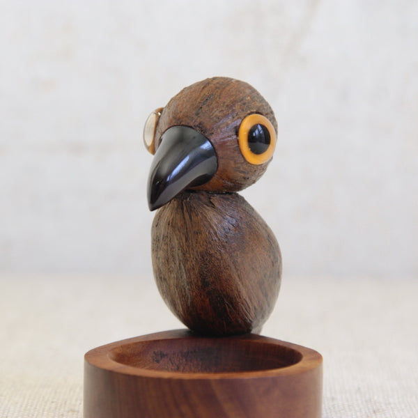 Henry Howell & Co. YZ bird tray with Faturan cherry amber beak, expressive glass eyes, and sculptural coquilla nut body, a highly desirable Art Deco collectible.