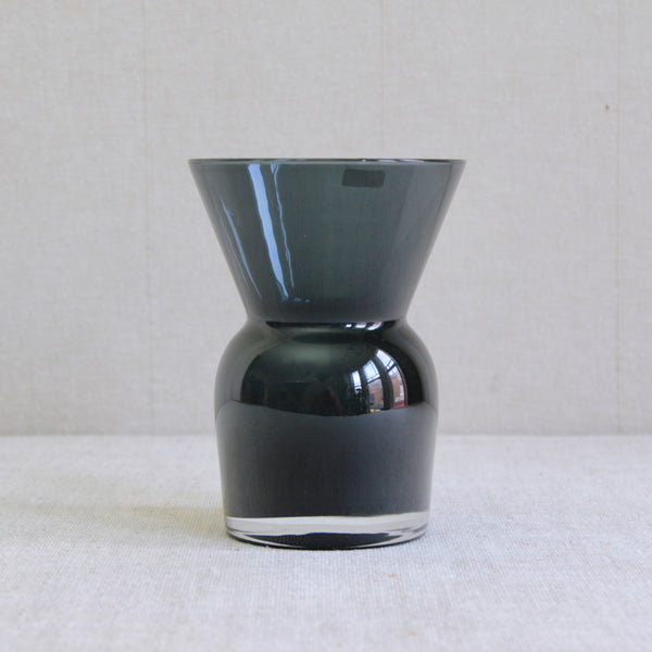 Grey-blue and clear cased glass vase designed by Inkeri Toikka for Nuutajärvi Notsjö, Finland, circa 1975. Stout sculptural form with flared mouth, antique-inspired silhouette, suitable for flower arranging, mid-century Finnish glass design.