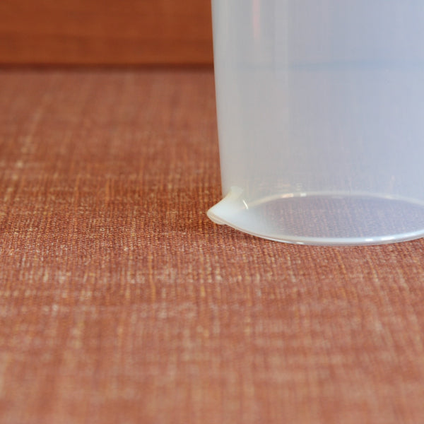 The Jacob Bang conical Opaline carafe viewed from above and upside down, showing its hand pulled pouring lip and sculptural geometry.