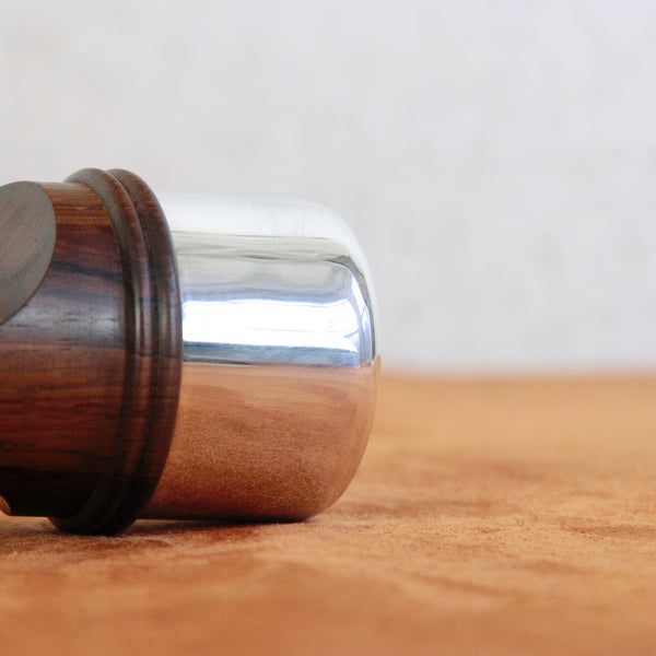 Close-up of silver band on a Jens Quistgaard Rosewood & Silver series pepper grinder. Rare Scandinavian collectible available for sale in the UK.
