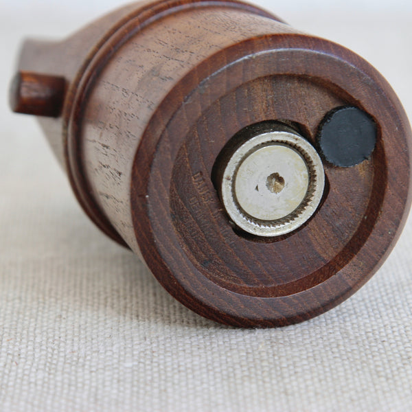A sculptural Scandinavian teak “whistle” pepper mill designed by Jens Quistgaard for Dansk Designs, celebrated by collectors of mid-century design.