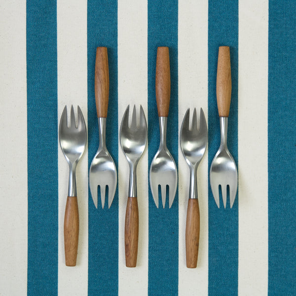 Aerial view of 6 salad forks from Jens Quistgaard's 'Fjord' flatware series. Designed in 1953 for Dansk Designs. These items are part of a 40 piece set for sale in London from design gallery Art and Utility. 
