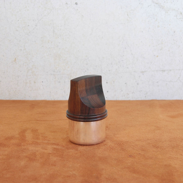 Top down view showing the flathead screwdriver-inspired form of a mid-century pepper mill by Jens Quistgaard for Dansk Designs.
