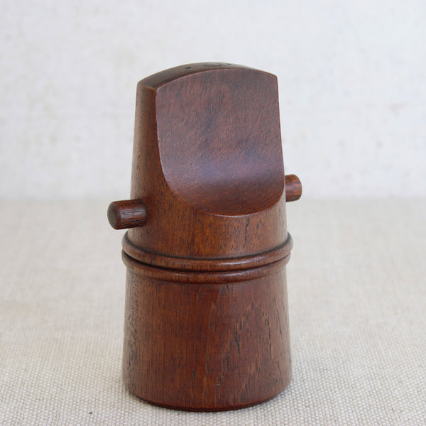 This Scandinavian “whistle” pepper mill in solid teak was designed by Jens Quistgaard for Dansk Designs during the mid-century period.
