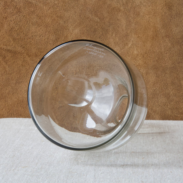 A clear glass Model KF 502 1502 Kukkopullo rooster bottle by Nuutajarvi Notsjo. The underside of base features an etched signature and date which read K. Franck Nuutajärvi Notsjö 60.