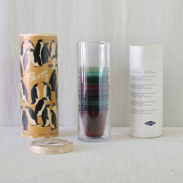 Kaj Franck model 1609 cylindrical pitcher with stackable model 2744 glasses, demonstrating the ingenious space-saving design of the Party-set.