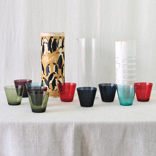 Head on image of multicoloured 1950s cocktail glasses by Kaj Franck in purple, green, red, turquoise and blue glass. For sale in the UK.