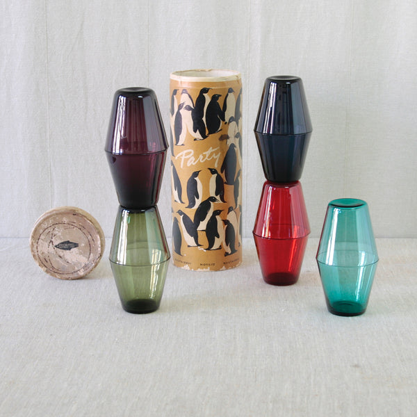 Kaj Franck pitcher and model 2744 Kartio glasses in five different colours, designed to stack neatly one inside another.