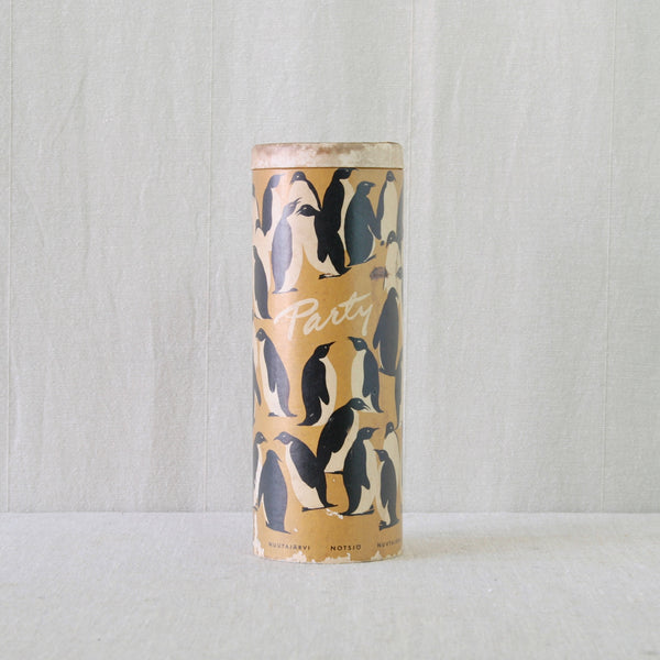 Cylindrical original penguin-covered cardboard tube made to contain Kaj Franck's colourful 1950s Party-set.