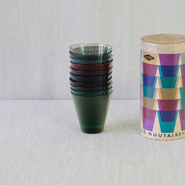 Ten colourful Kaj Franck cocktail glasses comprising two purple, two turquoise, two blue, three green and a single brilliant red example.