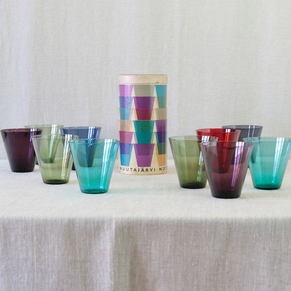 Kaj Franck's 1954 Toive box, featuring a wonderfully jazzy graphic design of brightly coloured glasses floating, overlapping and tumbling across the surface.