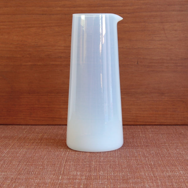 The Kastrup Opaline carafe photographed upright, emphasising its laboratory-glass influence and Danish Functionalist design.