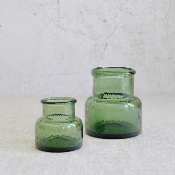 Nanny Still designed Neptuna vases in pale green glass, produced by Riihimäen Lasi and inspired by the fluidity of water.