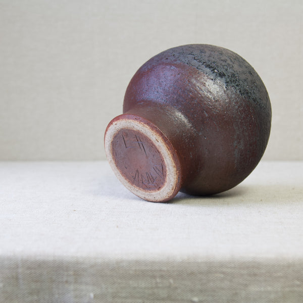 Modernist Liisa Hallamaa chamotte studio pottery vase from Arabia, Finland, 1960's, showing highly textured brown glaze.