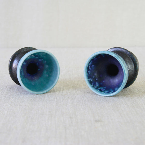 1960s ceramic candleholders by Liisa Hallamaa, their unusual hourglass-like forms handmade in stoneware at Arabia Finland.