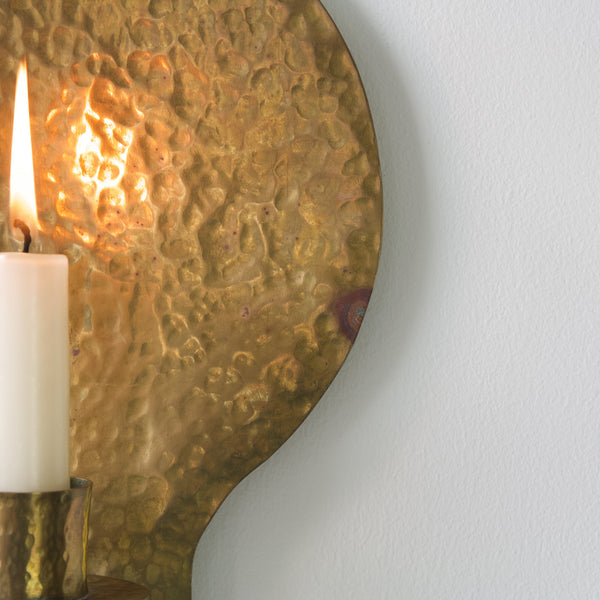 One-of-a-kind hammered brass wall sconce, showcasing artisanal craftsmanship from the 1950s.