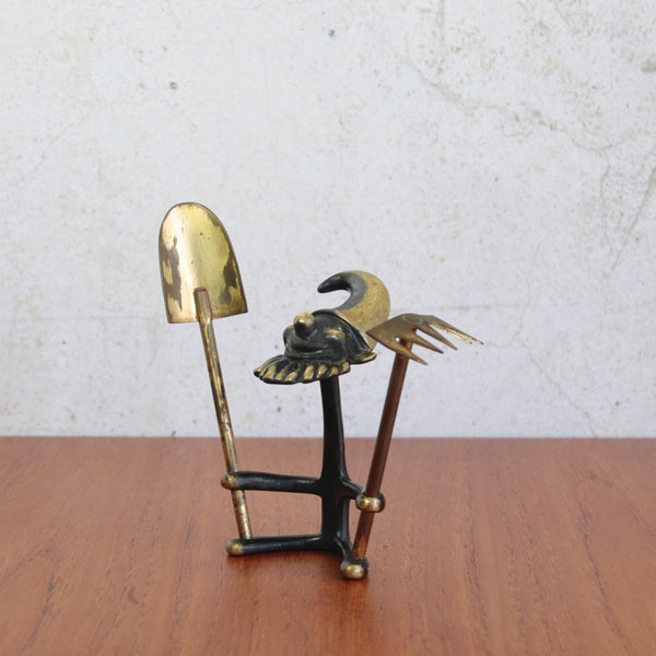 Mid-century Walter Bosse gnome with gardening tools, playful bonsai accessory for desk or tabletop.