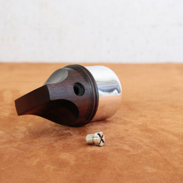 Detail of plugging screw removed from an iconic mid-century modern pepper mill designed by Jens Quistgaard for Dansk Designs.