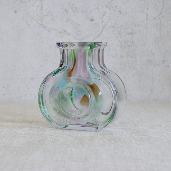 Glass vase with multicolored swirl design on a light background. Helena Tynell Bora Bora vase exemplifying post-war Finnish glass innovation, produced by Riihimäen Lasi and dated to 1971.
