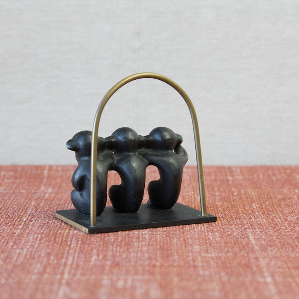 Rear view of Walter Bosse 'Three wise monkeys' brass letter rack