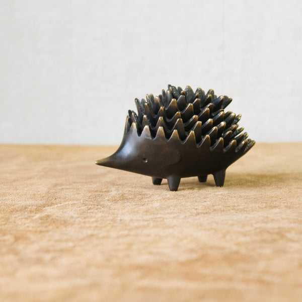 Iconic Modernist metal design by Walter Bosse from Vienna, Austria, a family of stacking patinated brass hedgehog ashtrays, 1950's