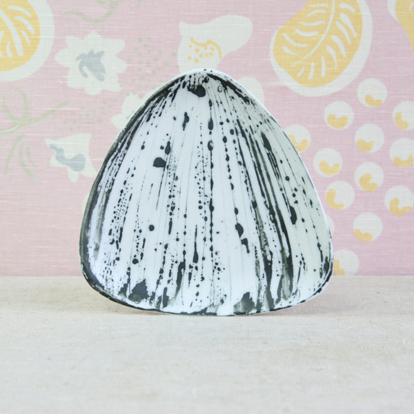 A triangular ceramic plate with a white glaze and black ink-blot pattern. Design by Susan Parkinson for Parkinson Pottery, reflecting the influence of William Newland and post-war British ceramics