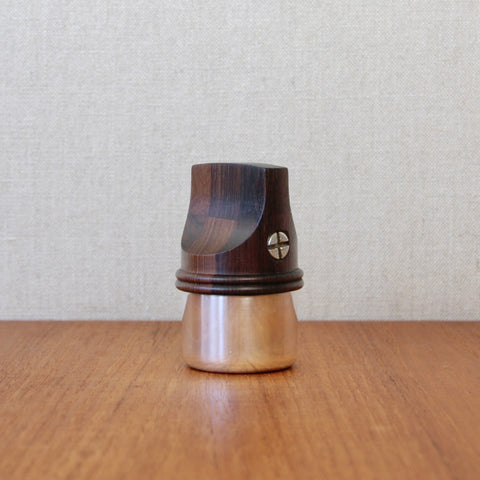 Profile image of a rare pepper mill from Jens Quistgaard’s Rosewood & Silver series for Dansk Designs, carved from staved rosewood with silver-plated detailing.