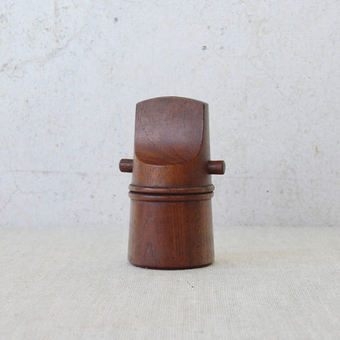 A classic Dansk Designs teak “mouthpiece” pepper mill by Jens Quistgaard, displaying warm timber tones and modernist simplicity.