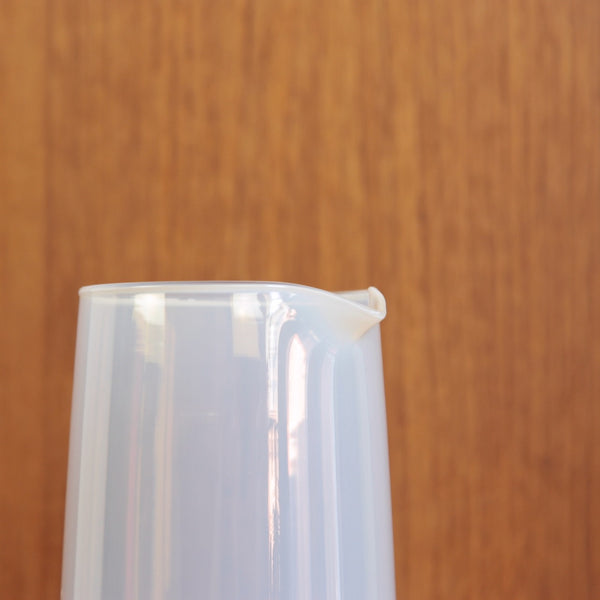 Close-up of the Jacob Bang Opaline carafe highlighting the smooth white glass surface made at Kastrup in Denmark.