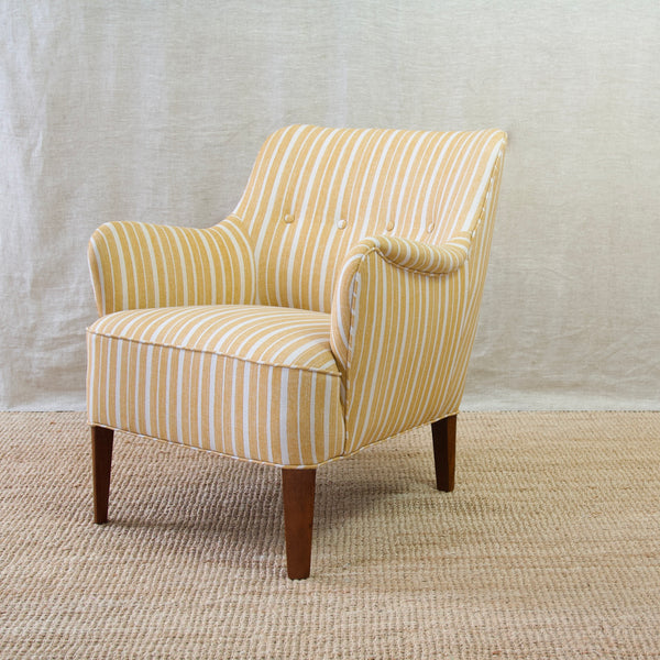 Vintage charm meets modern allure in the Model 1748 lounge chair upholstered in Fermoie York Stripe L-039, a true collector's item.