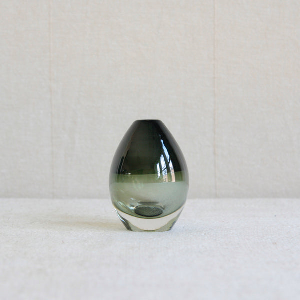 A small egg shaped vessel in two tones of green thanks to the incalmo technique. Design by Timo Sarpaneva for Iittala, Finland, 1957. A rare museum quality example of mid-century Nordic glass. For sale in the UK from Scandinavian design specialists Art & Utility.