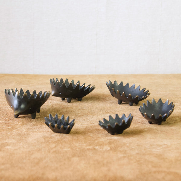 Six patinated brass hedgehog ashtrays designed by Walter Bosse, 1950's