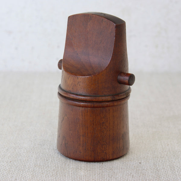 A rare collectible teak “flathead” pepper mill designed by Jens Quistgaard for Dansk Designs, emblematic of mid-century Scandinavian craftsmanship.