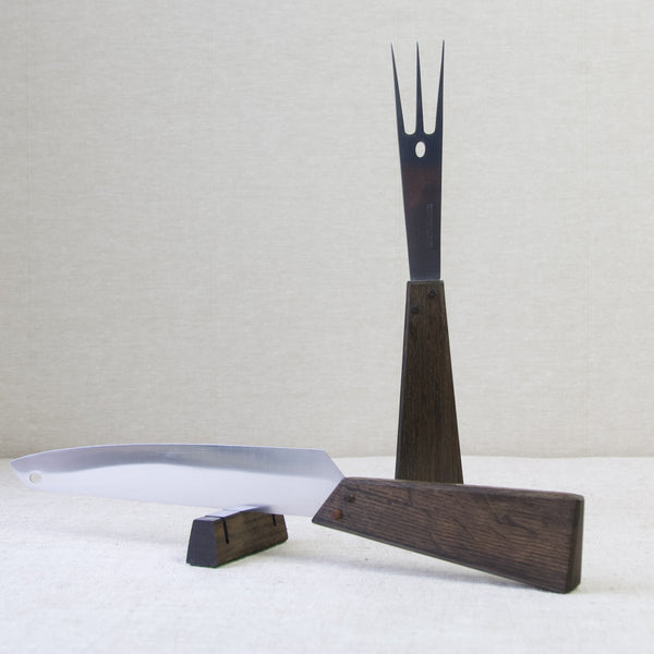 An image of a Tapio Wirkkala carving set with wooden handles made from black oak from t=he 17th century Swedish warship Vasa. It is wonderful how this design not only evokes history but can still be used at the dinner table -surely a tremendous addition to a dinner party!