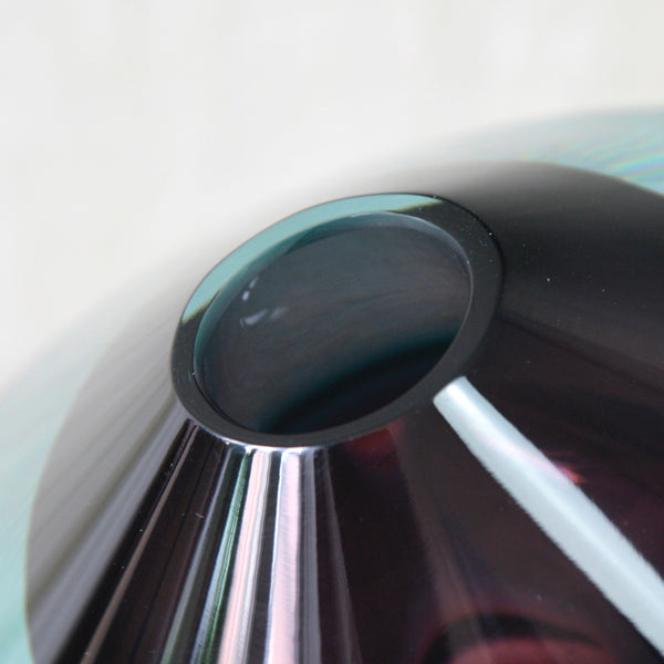 Close-up of the mouth opening of a Kaj Franck KF 235 Lentävä lautanen, or Flying Saucer, designed in 1956 for Nuutajärvi Notsjö, Finland, in purple and sea-blue cased glass.