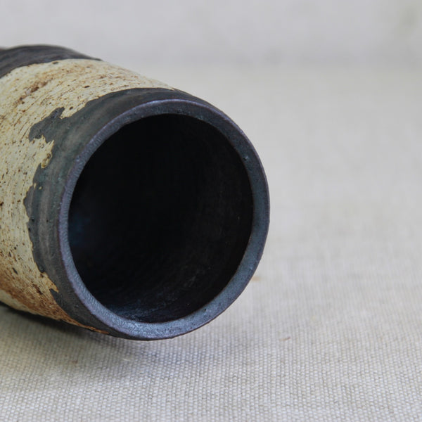 Close-up of a ceramic vase's mouth/opening. Arabia Finland Ceramic Hourglass Vase Handthrown by Annikki Hovisaari.