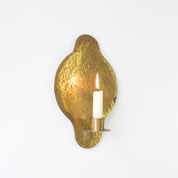 Authentic Swedish brass wall sconce featuring a quatrefoil design, reminiscent of Gothic and Renaissance motifs.