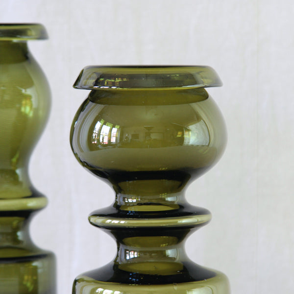 Nanny Still model 1405 vase in rich olive green glass, with the curvaceous undulating silhouette characteristic of the Pompadour series.