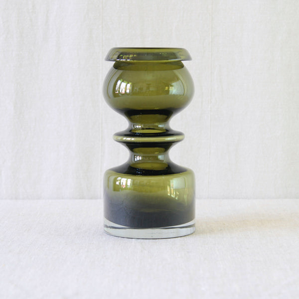 Nanny Still model 1405 Pompadour vase for Riihimäki Glassworks, designed in 1966 with a bold hooped form in deep olive green glass. Art and Utility, UK.