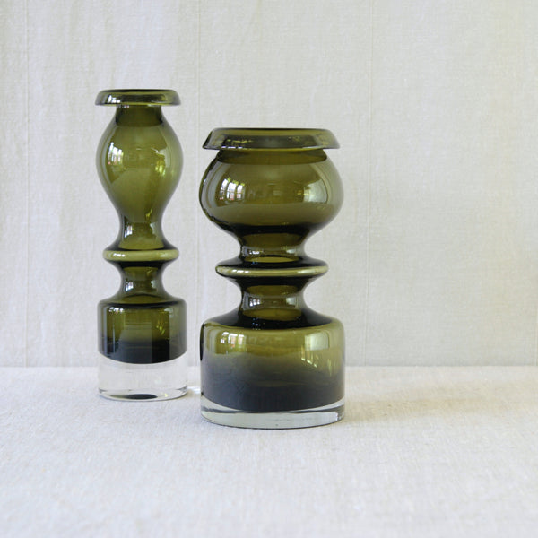 Nanny Still Pompadour vases in exceptionally thick and heavy glass, with a deep olive green body and clear base made by Riihimäki Glassworks.