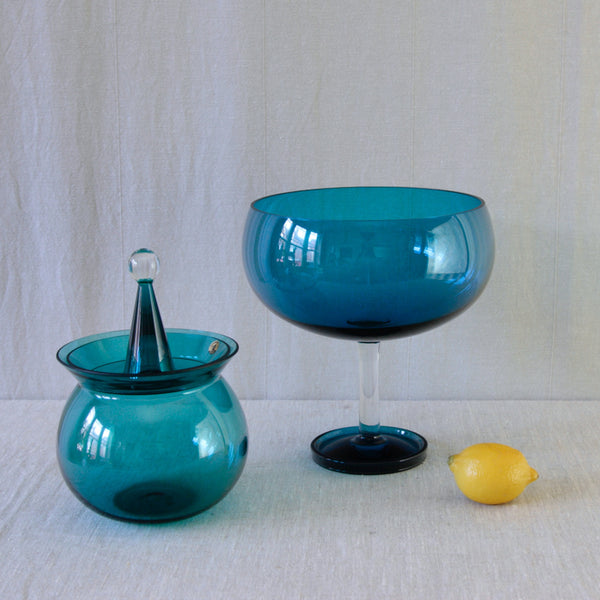 Turquoise-blue footed bowl by Nanny Still for Riihimäki Finland, originally designed for serving desserts. Styled with bob-bon dish from the same series.