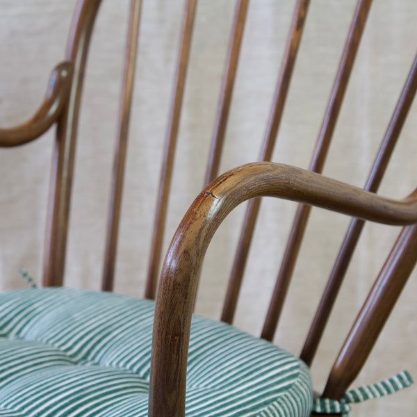 Vintage Niels Eilersen Danish Windsor chair featuring an elegant steam-bent wood construction for durability and style.