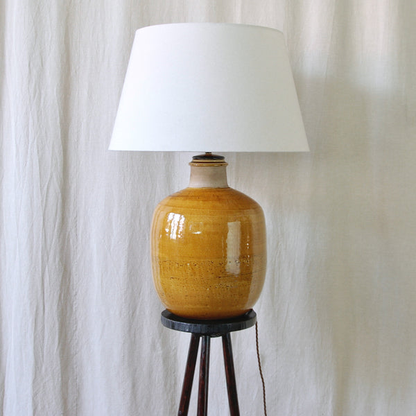 Vintage Nils Kähler table lamp for HAK Kähler, Denmark, with a large bulbous stoneware body and glossy yellow-ochre glaze.