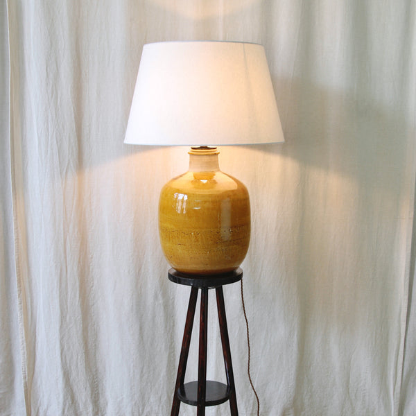 Large stoneware table lamp by Danish ceramicist Nils Kähler, with a sculptural bulbous form and warm high-gloss ochre glaze.