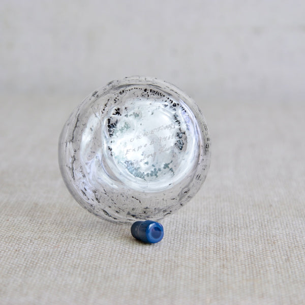 Underside / base of Scandinavian art glass piece from Sweden with bubbled texture and striking blue stopper. The base of the bottle is finely hand-engraved with Ingeborg Lundin’s signature and the inscription Orrefors Expo D 346 - 68.
