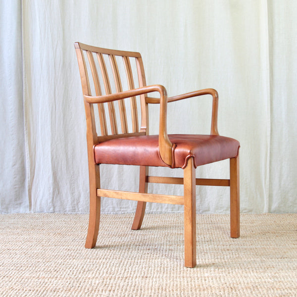 Detail of the curved beech armrest on Ole Wanscher's Model 1675 chair for Fritz Hansen, Denmark.