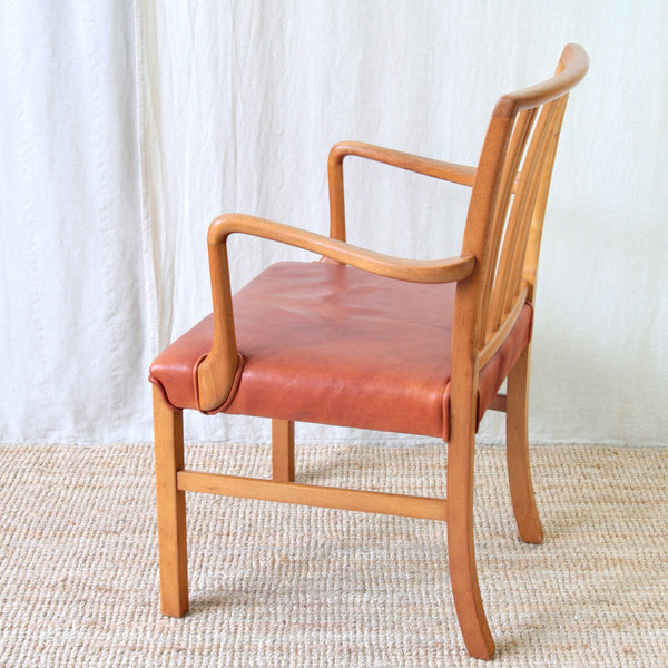 A mid-century modern wooden Model 1675 desk or carver chair designed by Ole Wanscher. 